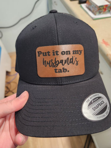Put It on My Husband’s Tab Leather Patch Hat – Funny Snapback for Shopping Queens - Trucker Hat - Charm and Char