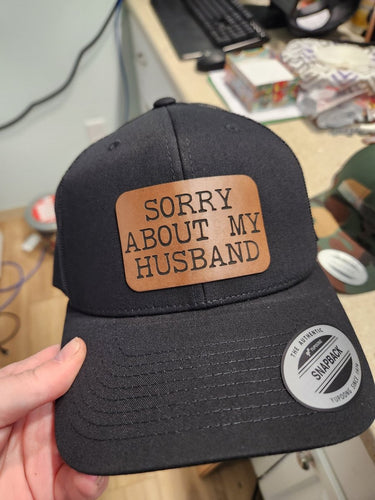Sorry About My Husband Leather Patch Hat – Hilarious Trucker Cap for Wives - Trucker Hat - Charm and Char