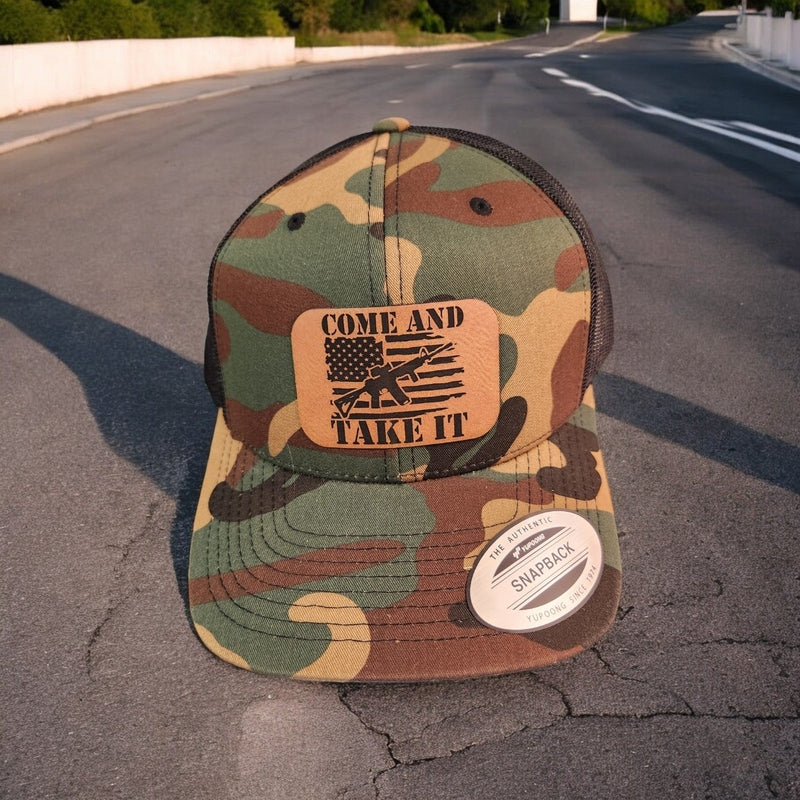 Come and Take It American Flag AR Leather Patch Trucker Hat Camo