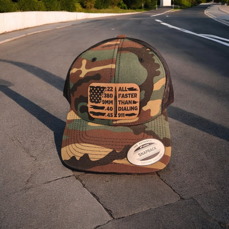 All Faster Than Dialing 911 Ammunition & American Flag Leather Patch Trucker Hat Camo