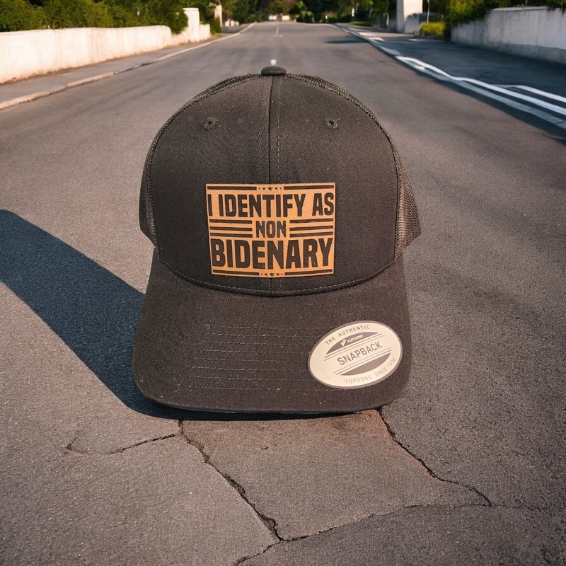 I Identify as Non-Bidenary Leather Patch Trucker Hat Black